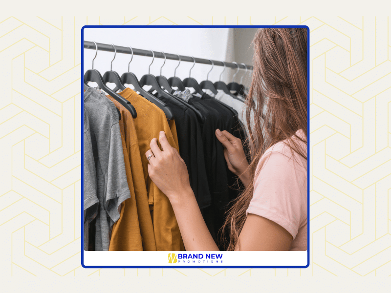 Business team reviewing promotional items with logo such as branded apparel and drinkware to select effective marketing products
